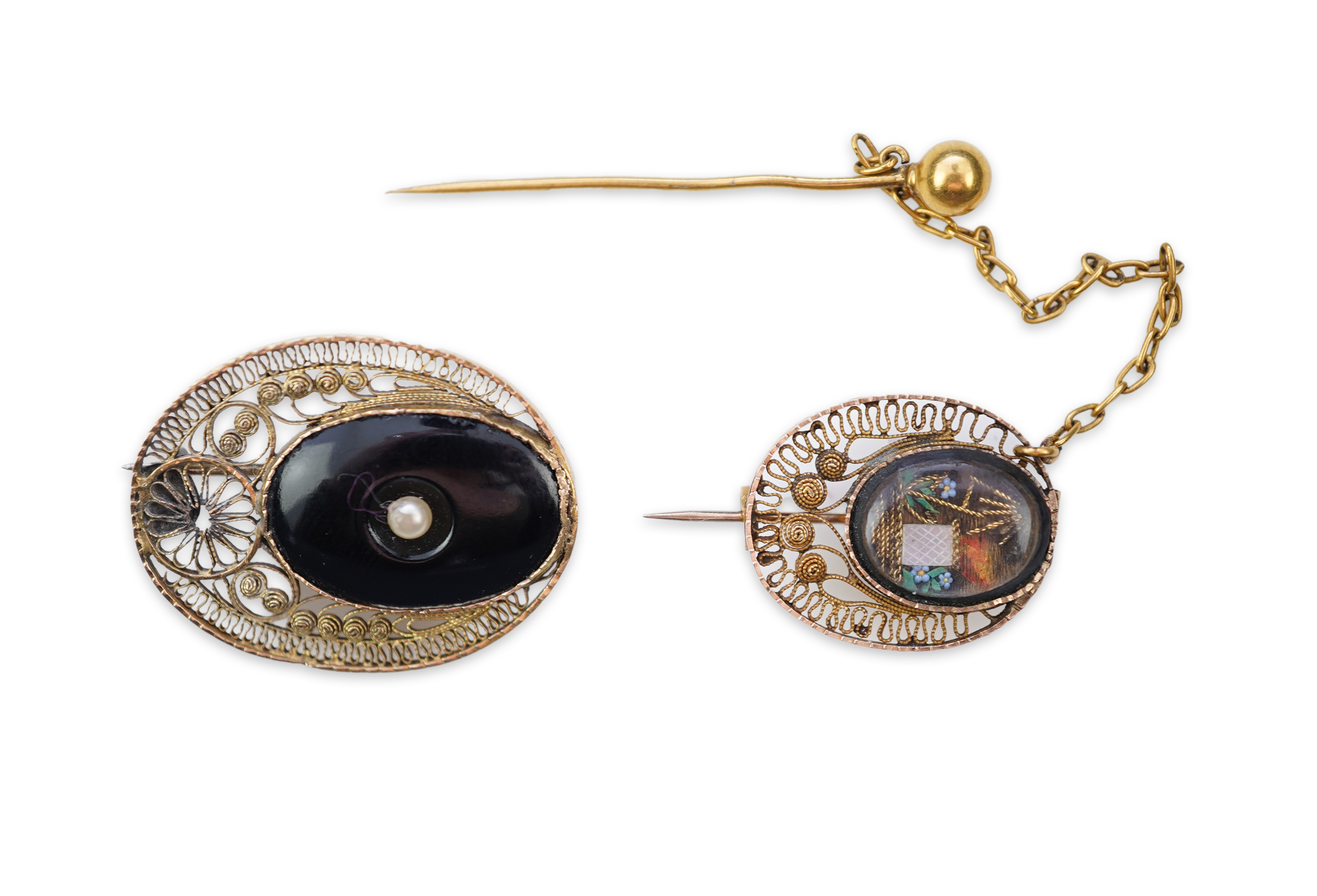A collection of shell cameo brooches, comprising: a cameo depicting Bacchus, in a gold mount in the Archaeological Revival style, decorated with rope twist and a twisted knife wire border, length 4.4cm; together with sev